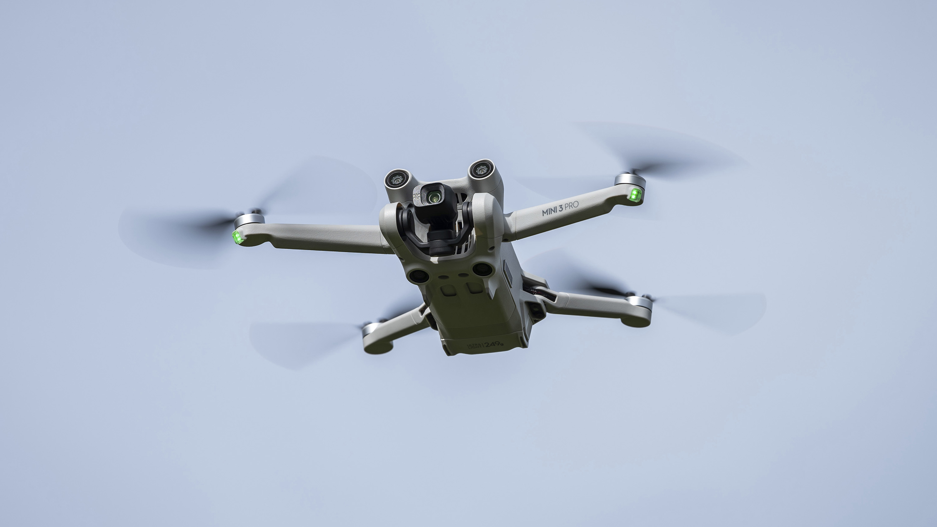 A DJI Mini 3 PRO drone from the Chinese manufacturer in flight.