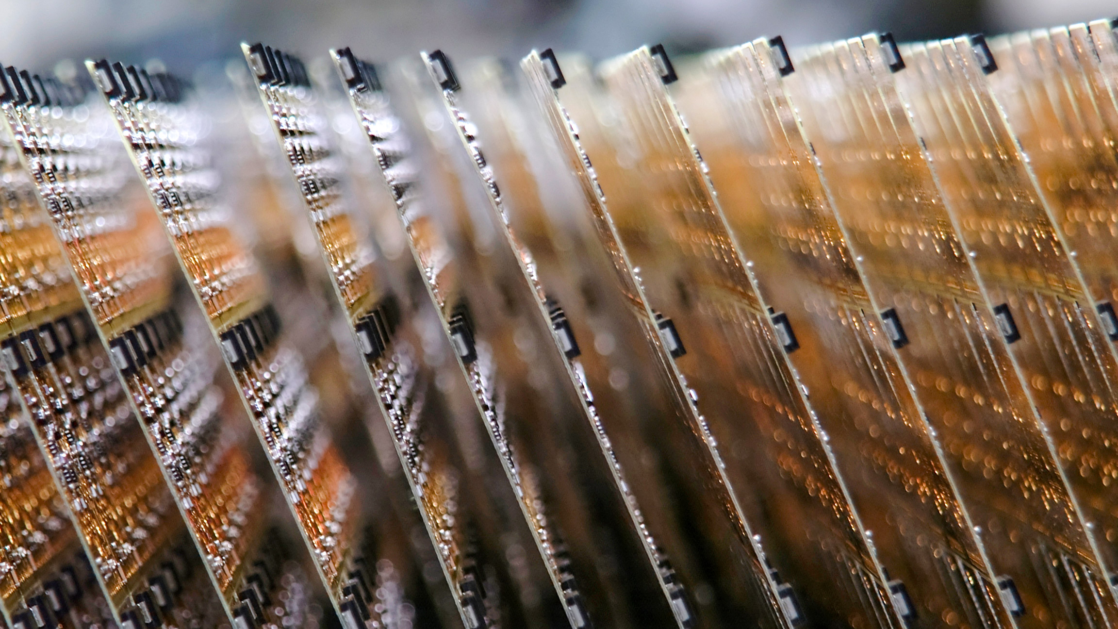 Electronic circuit boards stacked on an assembly line.